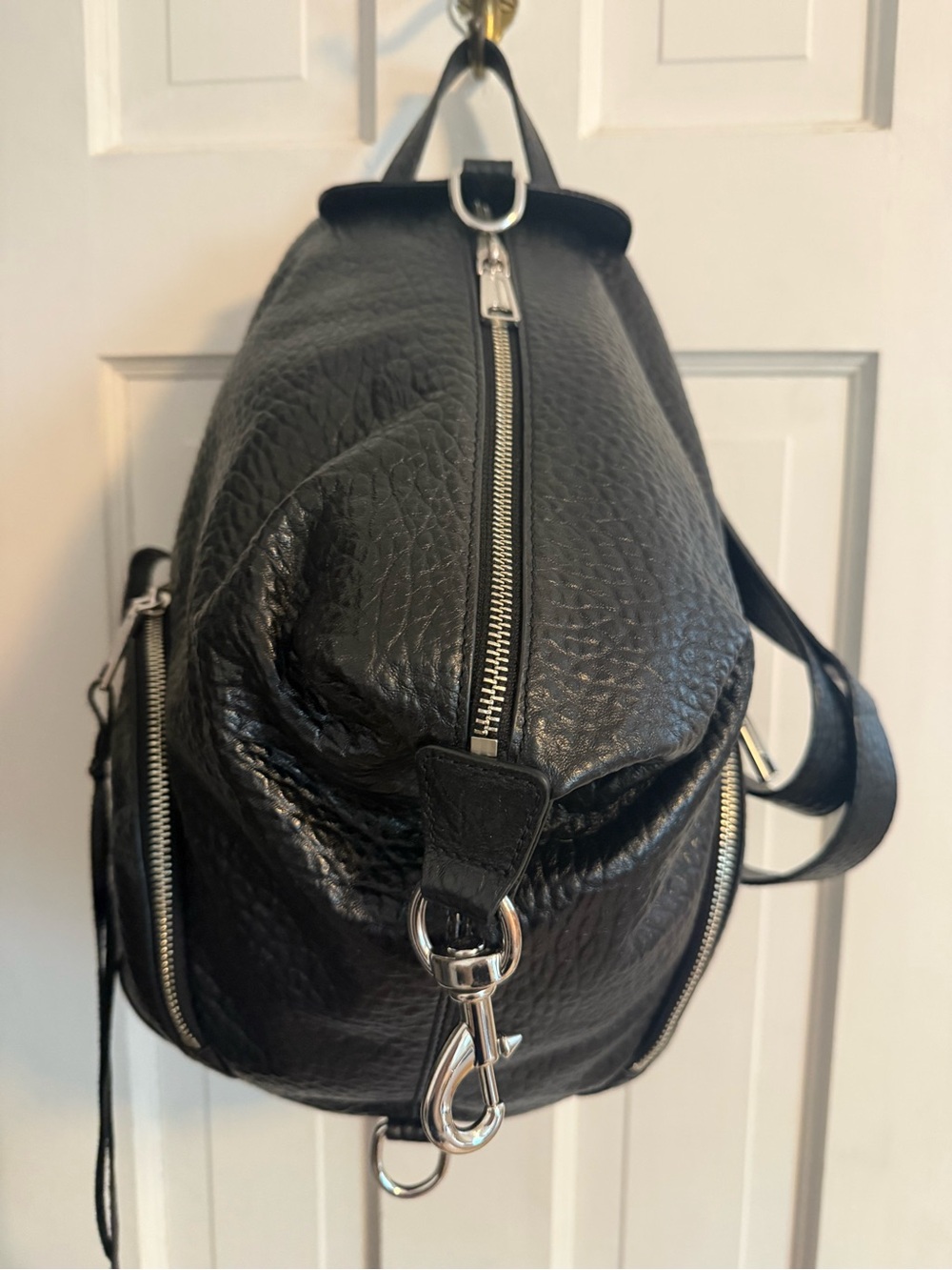 Rebecca Minkoff Black Pebbled Leather Backpack with Silver Hardware.